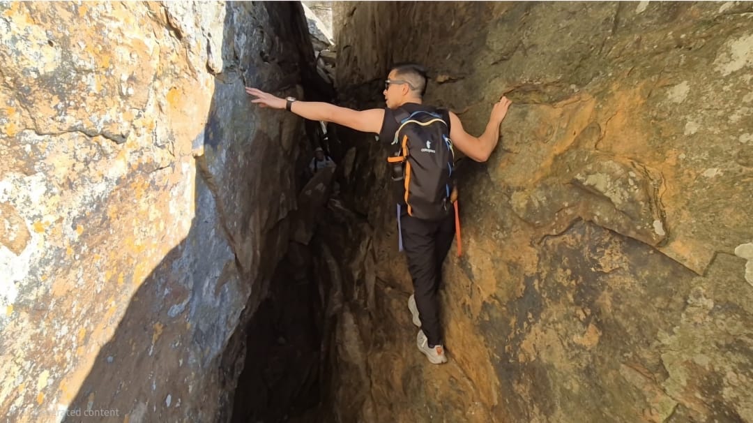 Miclen LaiPang in the Arrow Face Traverse Cracks on Table Mountain